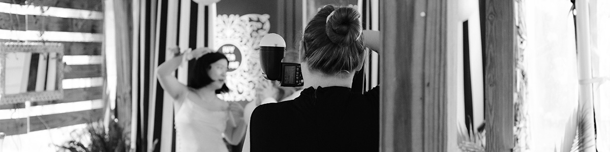 Photo pf cassie taking pictures of clients